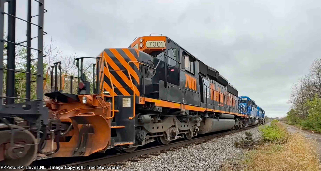 WE 7001 is shoving past me.